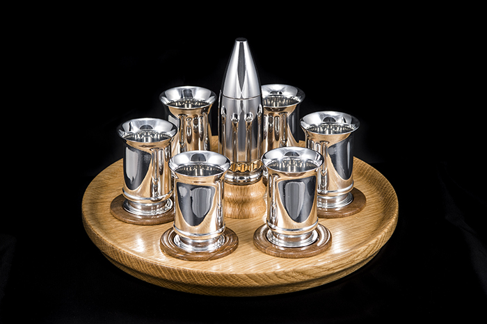 Oak tray with walnut inserts supporting 30mm canon shell shot glasses